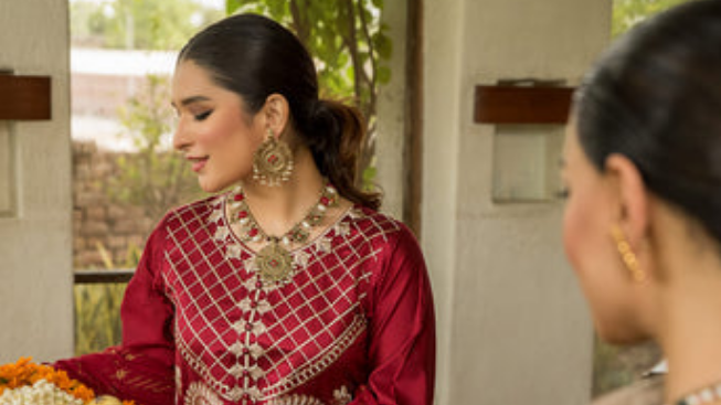 Red embroidered frock design in banner