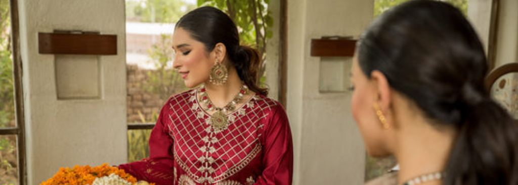 Red embroidered frock design in banner
